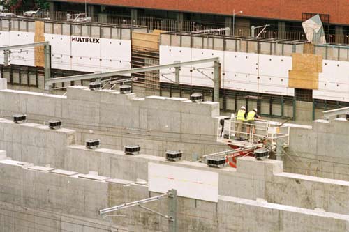 Isolation bearings on concrete wall