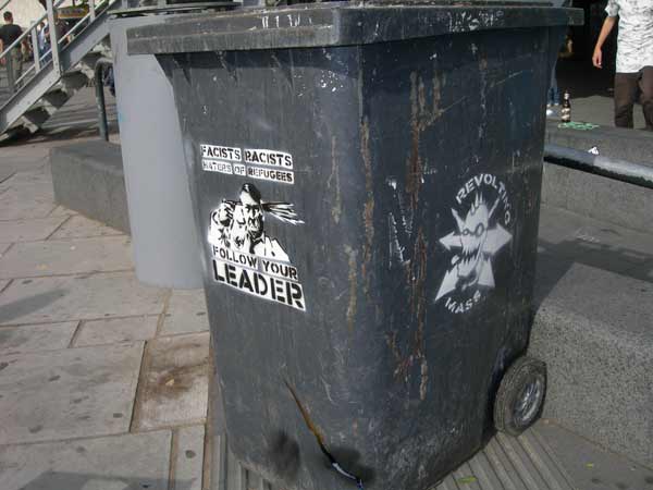 Hitler Suicide & Revolting Mass Stencils on Wheelie Bin, Embankment, London, UK Hitler Suicide & Revolting Mass Stencils on Wheelie Bin, Embankment, London, UK