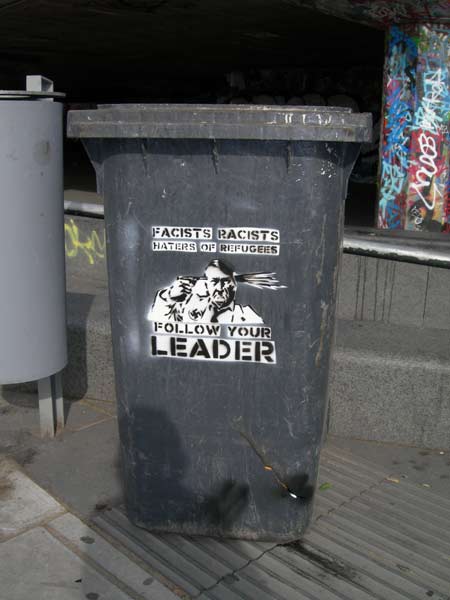 Hitler Suicide & Revolting Mass Stencils on Wheelie Bin, Embankment, London, UK Hitler Suicide & Revolting Mass Stencils on Wheelie Bin, Embankment, London, UK