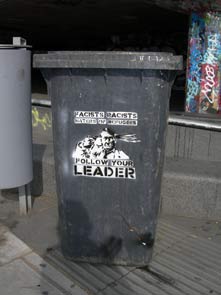 Hitler Suicide & Revolting Mass Stencils on Wheelie Bin, Embankment, London, UK Hitler Suicide & Revolting Mass Stencils on Wheelie Bin, Embankment, London, UK