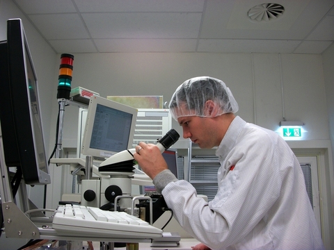 Mason UK Ltd - Scientist using an Electron Microscope