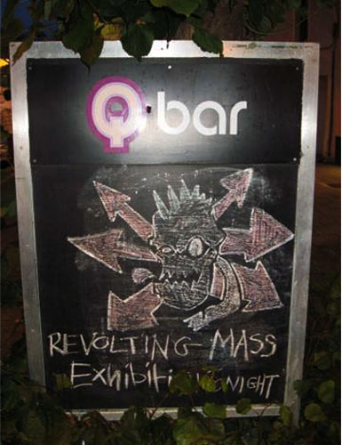 A valiant attempt by Stolen Wall Exhibition & Q-Bar staff to replicate the  Revolting Mass stencil logo