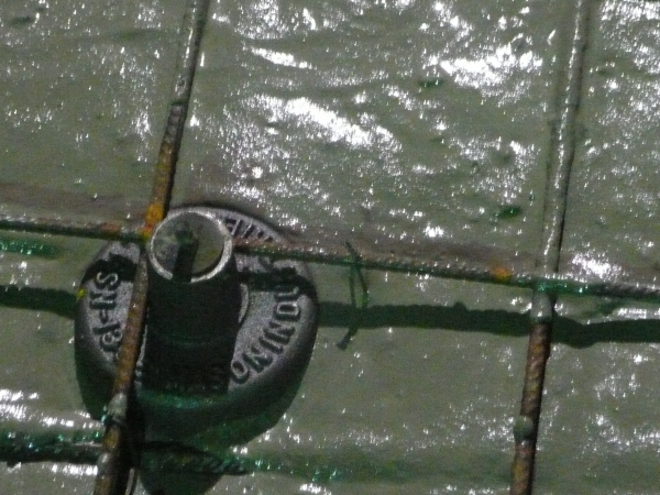 Concrete being poured over a jack