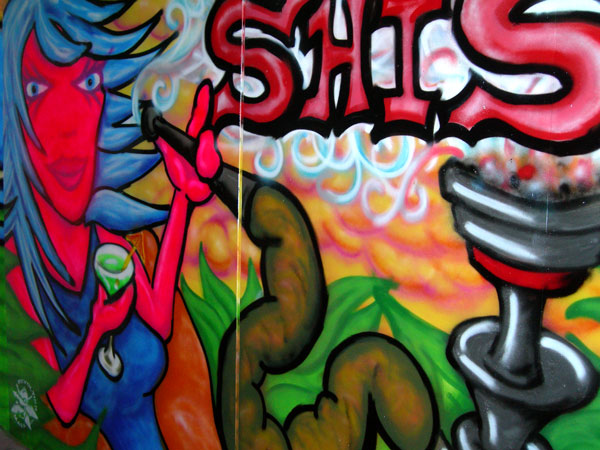 Graffiti of Woman Smoking Shisha Pipe on Pub Gates