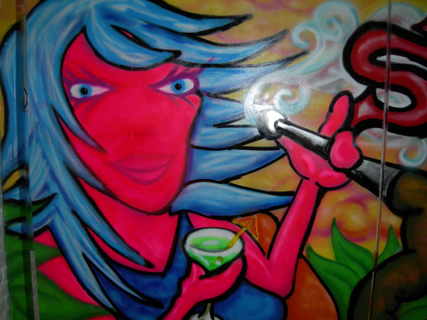 Graffiti of Woman Smoking Shisha Pipe on Pub Gates