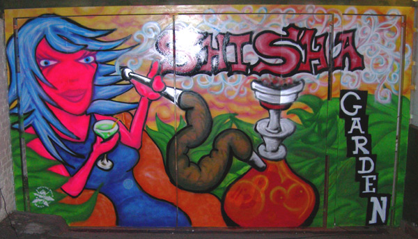 Graffiti of Woman Smoking Shisha Pipe on Pub Gates