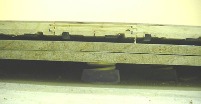 Cross section of a wooden floating floor + mount