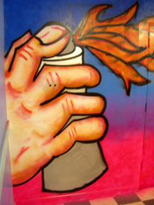 A hand spraypainting flames - Graffiti Lessons