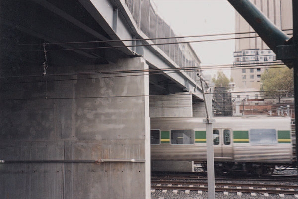 Train emerging next to isolated crash walls